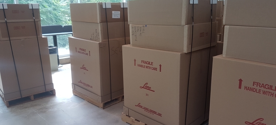 New cabinets and drawers on pallets in the halls of North Campus Building